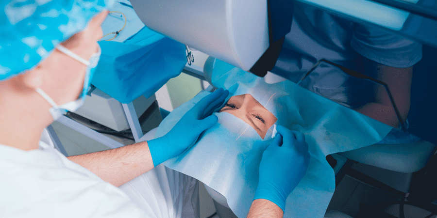 ophthalmologist performing lasik smile surgery on patient's eyes