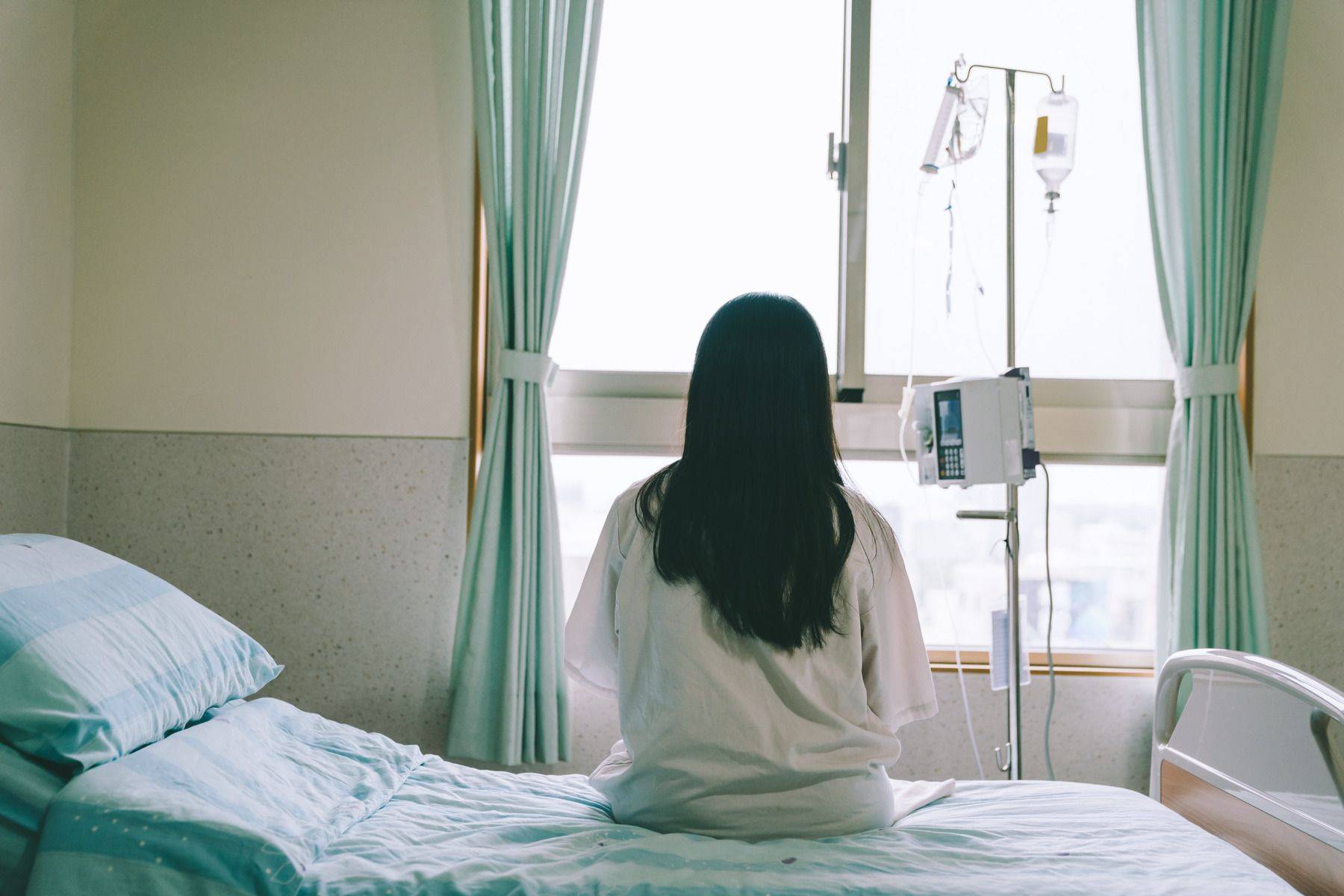 critical illness patient sitting on bed