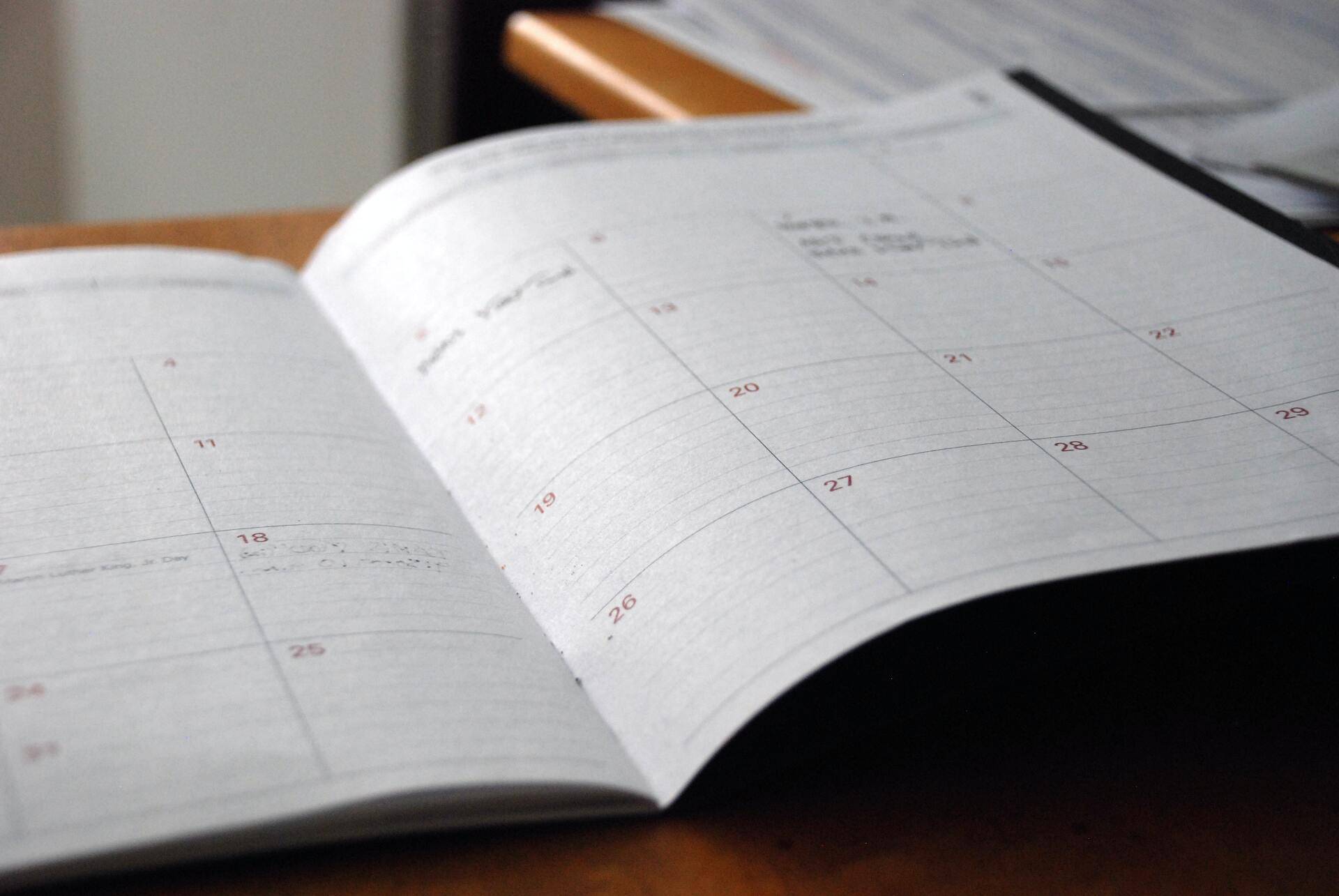 monthly calendar schedule open on a table