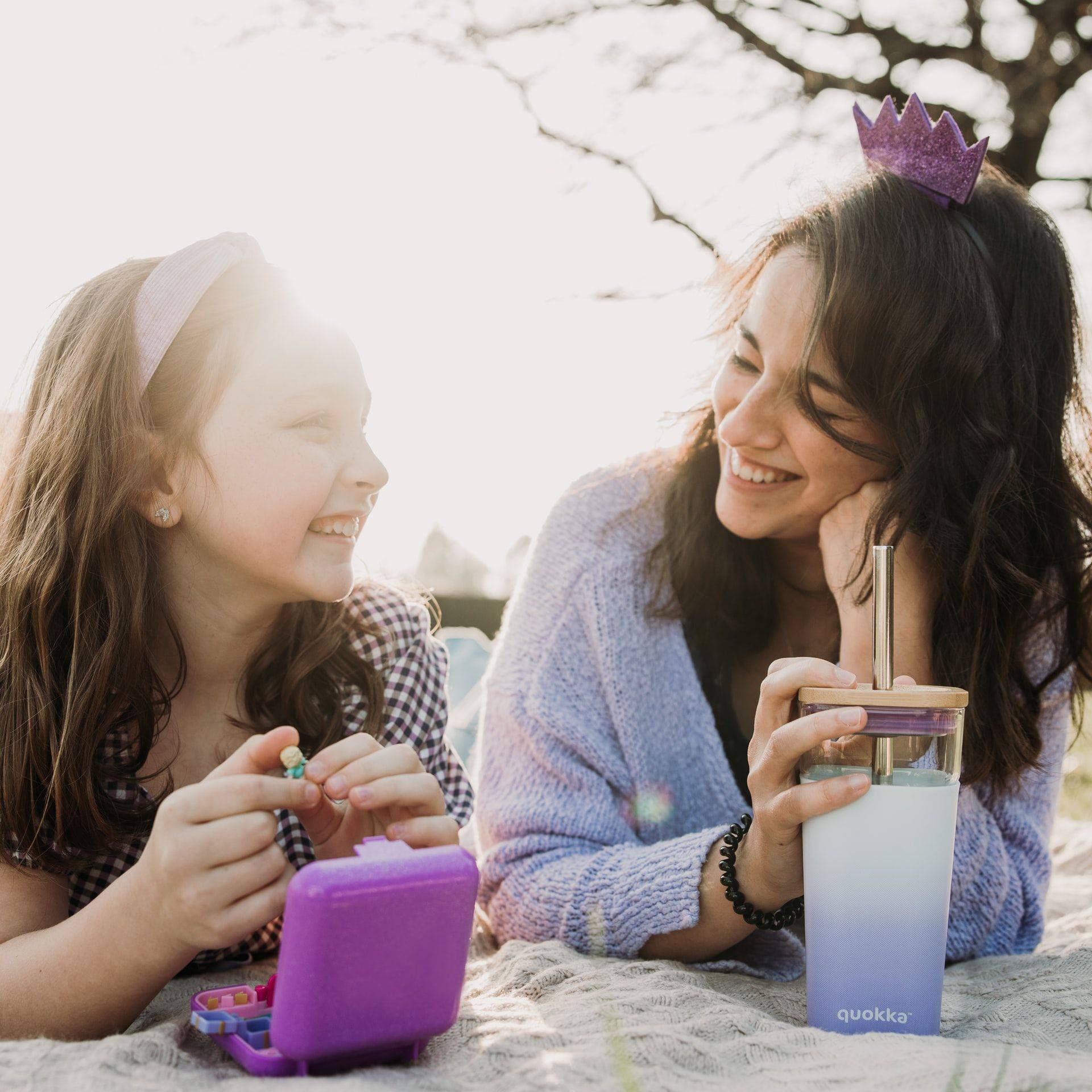 young mother and daughter smiling at each other