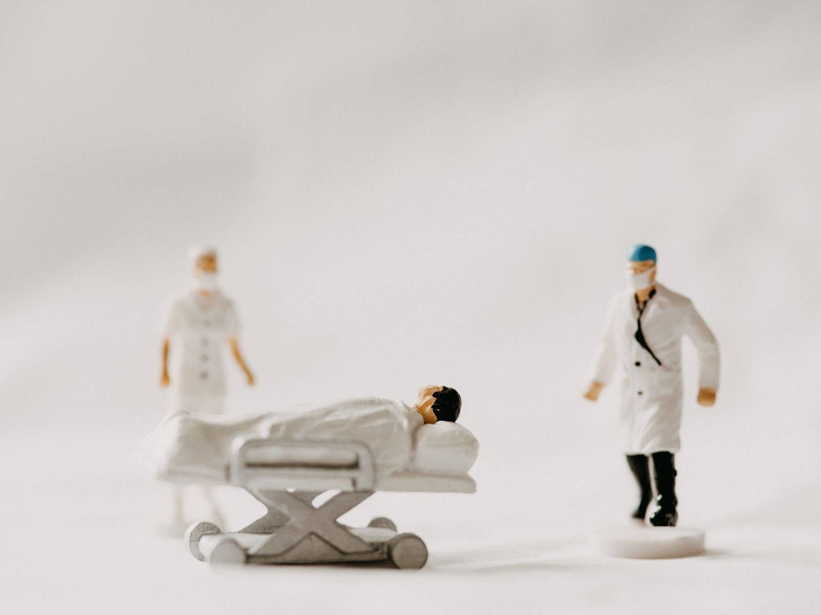 miniature medical staff illustrating high medical inflation in hk