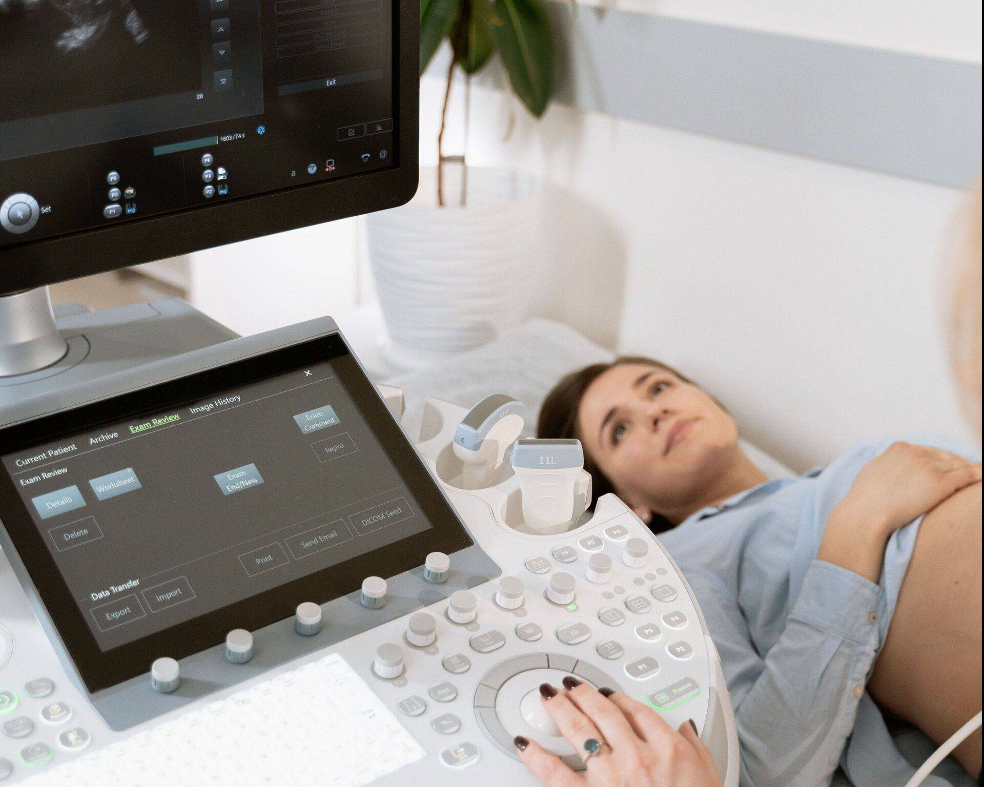 pregnant woman getting an ultrasound scan for her prenatal checkup